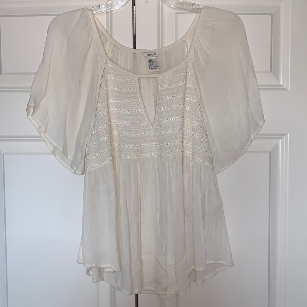 This is a beautiful sheer shirt perfect for summer and It’s a loose fit.